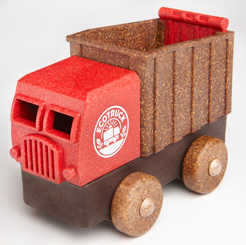 Educational toy truck with red front and flax fiber brown back on a white background.