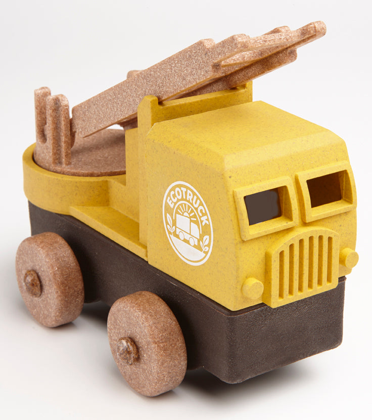 Yellow Fire truck toy with a brown bed and visible logo on a white background