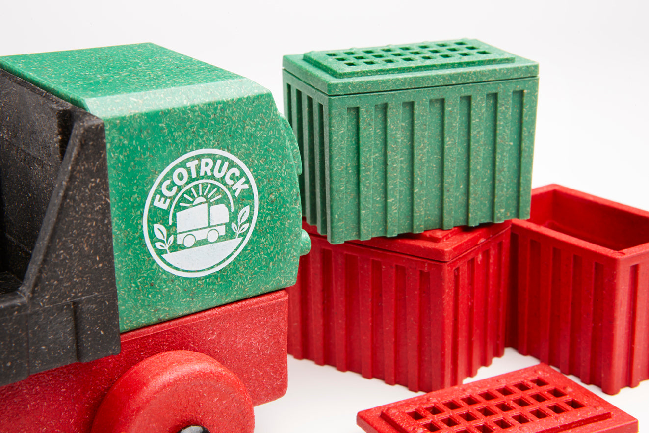 Toy truck with green and red compartments and 'ECOTRUCK' logo on a white background