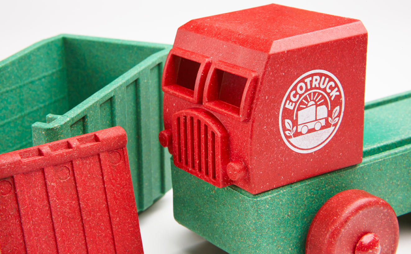 Red and green toy truck with 'EcoTruck' branding on a white background