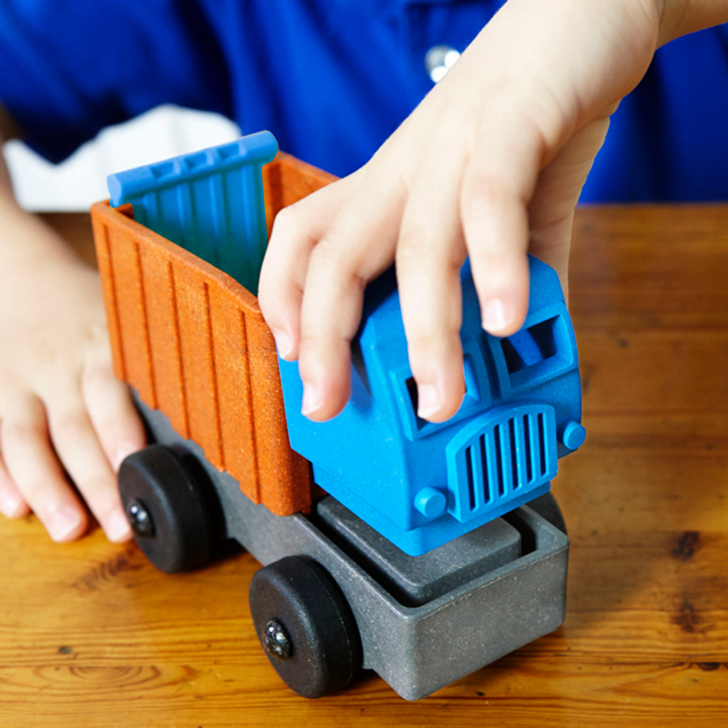 Preschool child assembling Dump Truck Toy
