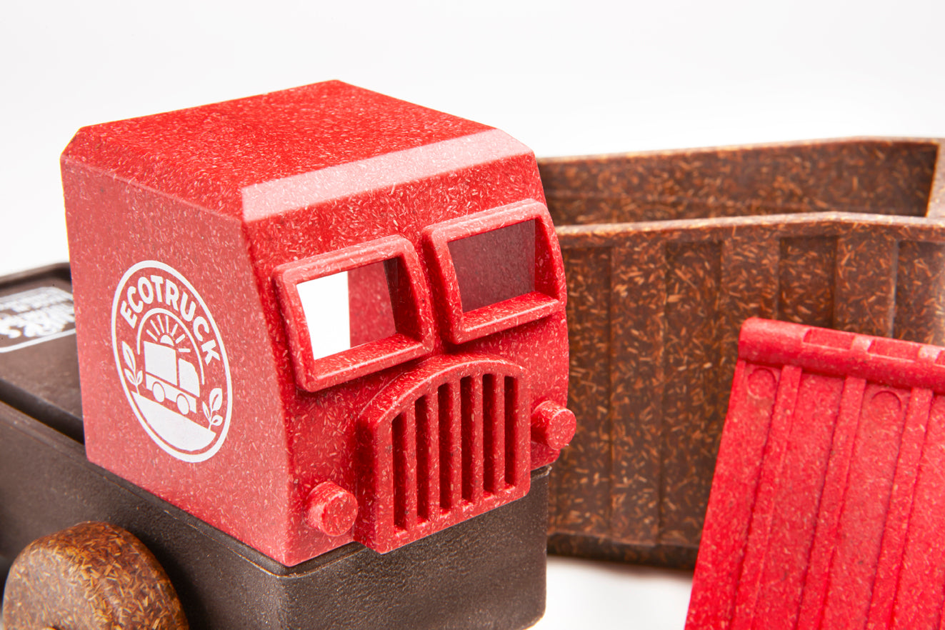 Red toy truck with 'EcoTruck' logo on a white background