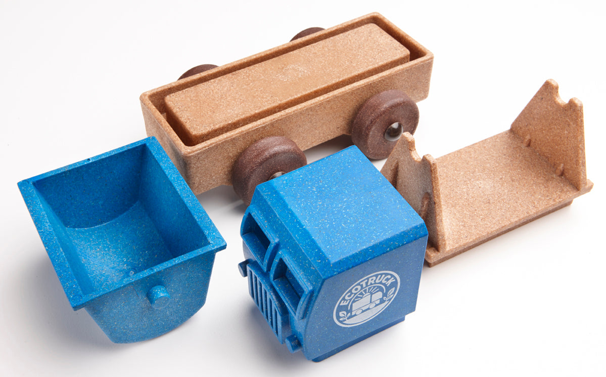 Two blue toy truck parts and two brown toy truck parts on white background