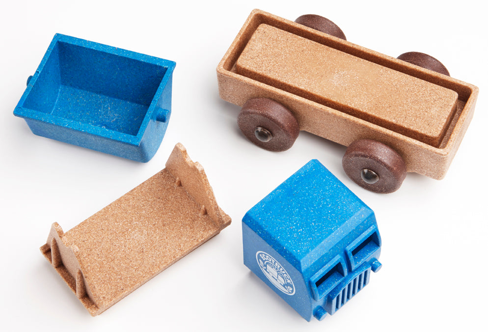 Four tipper truck toy parts from Luke's Toy Factory. Blue and brown parts on white background