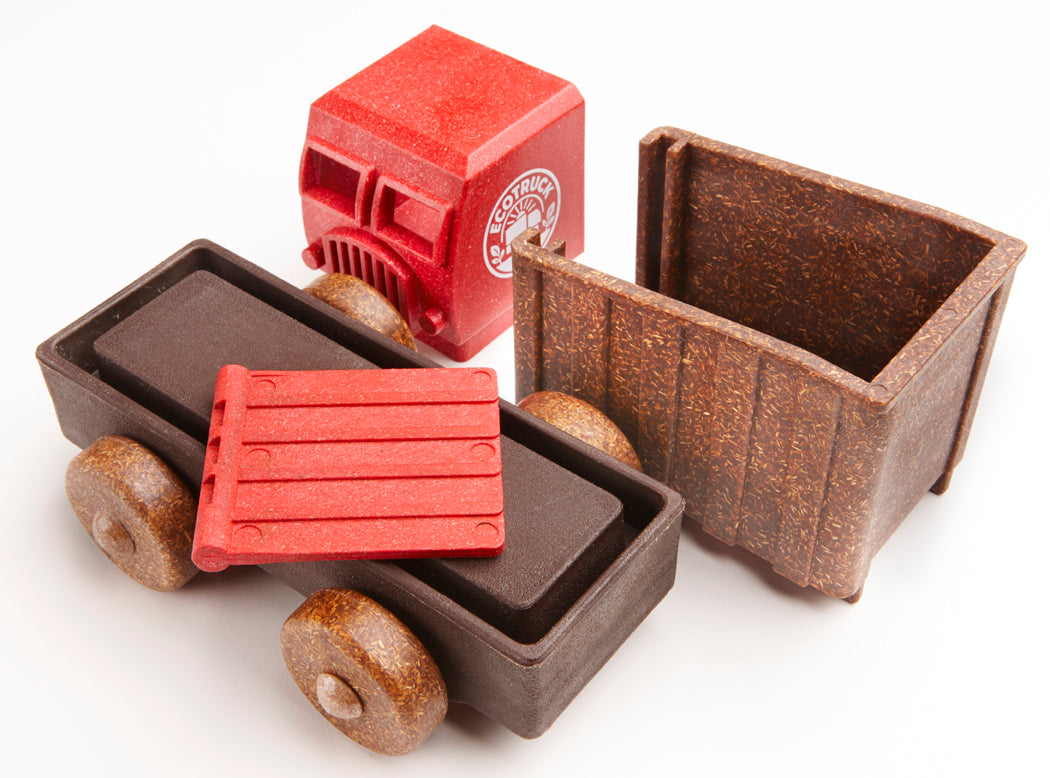 Dump truck toy parts with red and brown colors on a white background