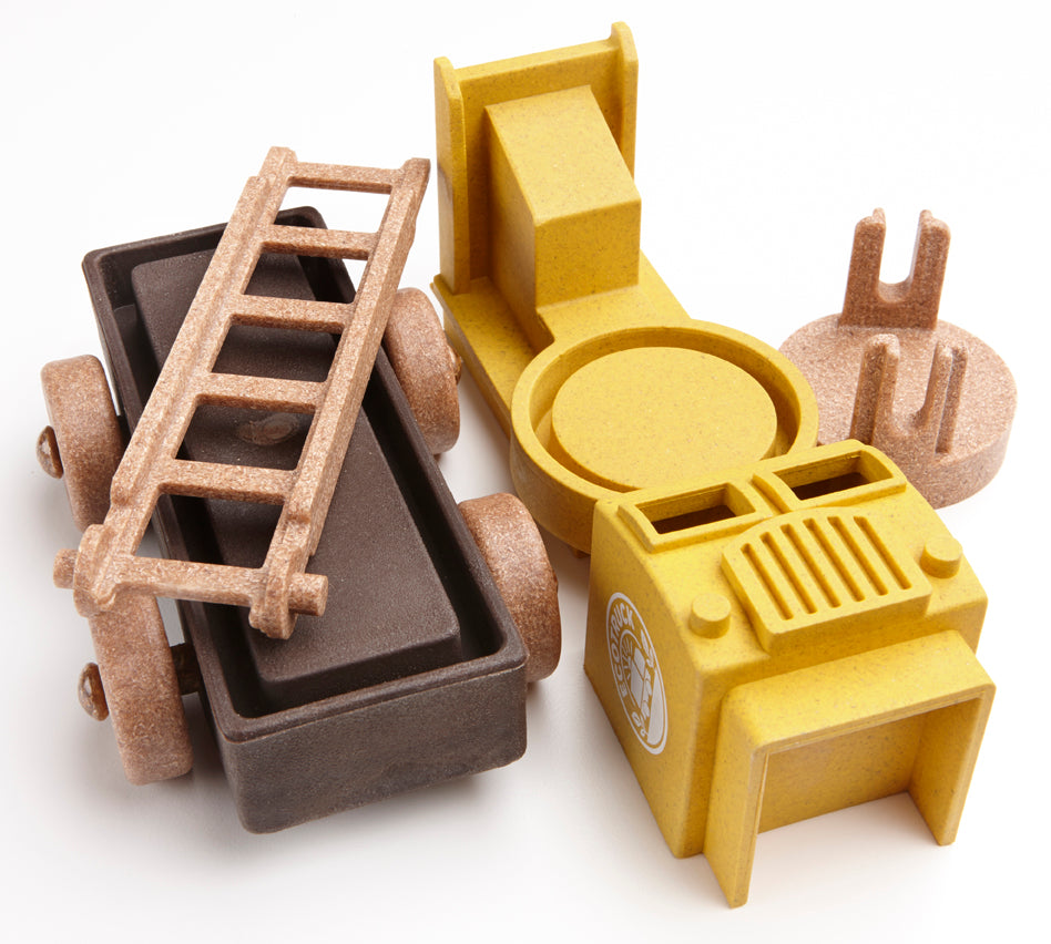 Educational preschool toy fire truck yellow parts on white background 