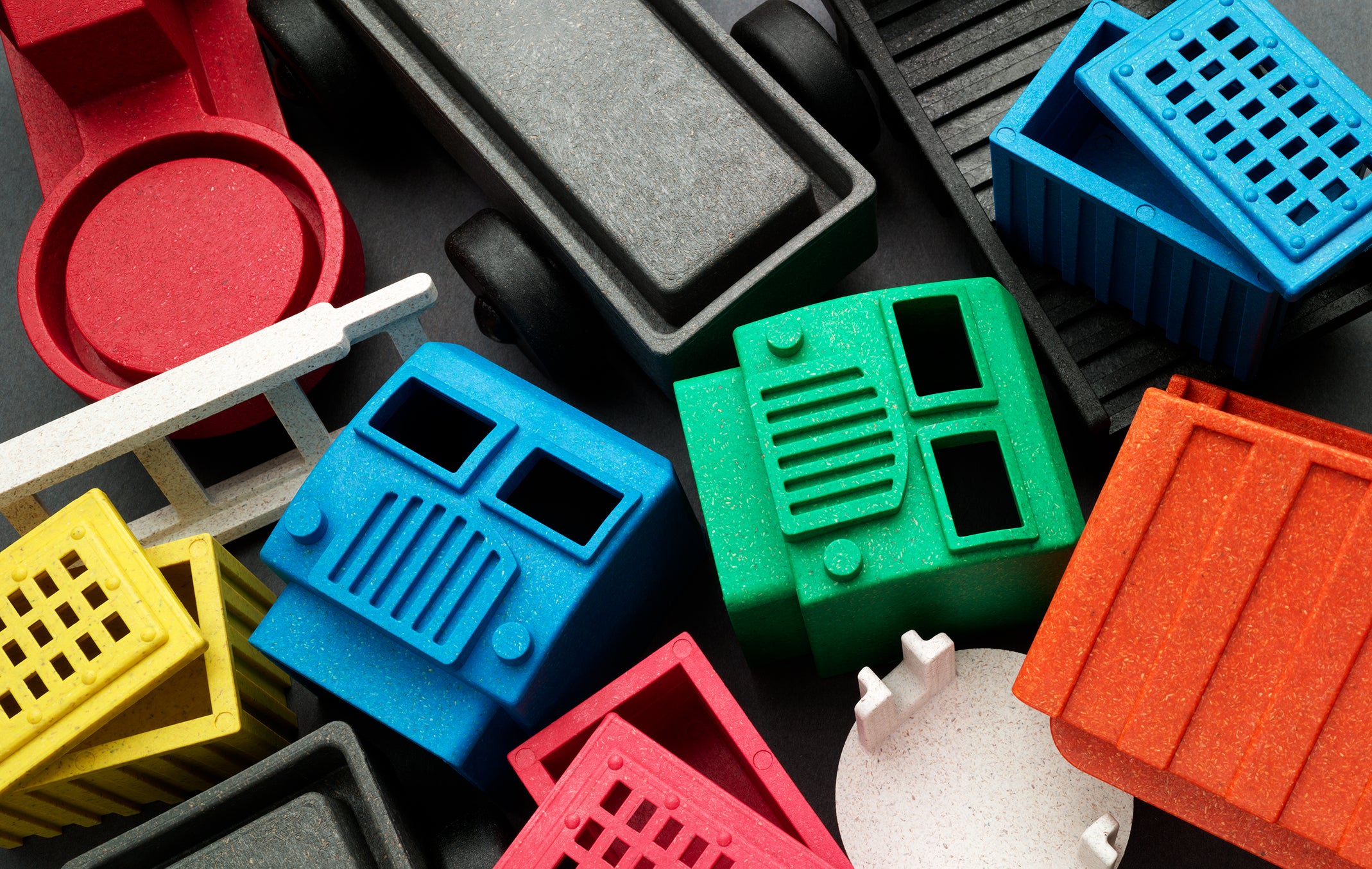 A closeup image of toy parts of Luke's Toy Factory preschool toy trucks