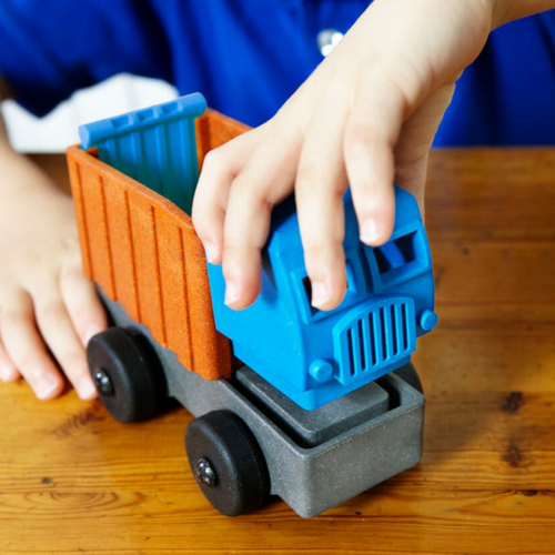 Dump Truck toy being put together by a preschool child